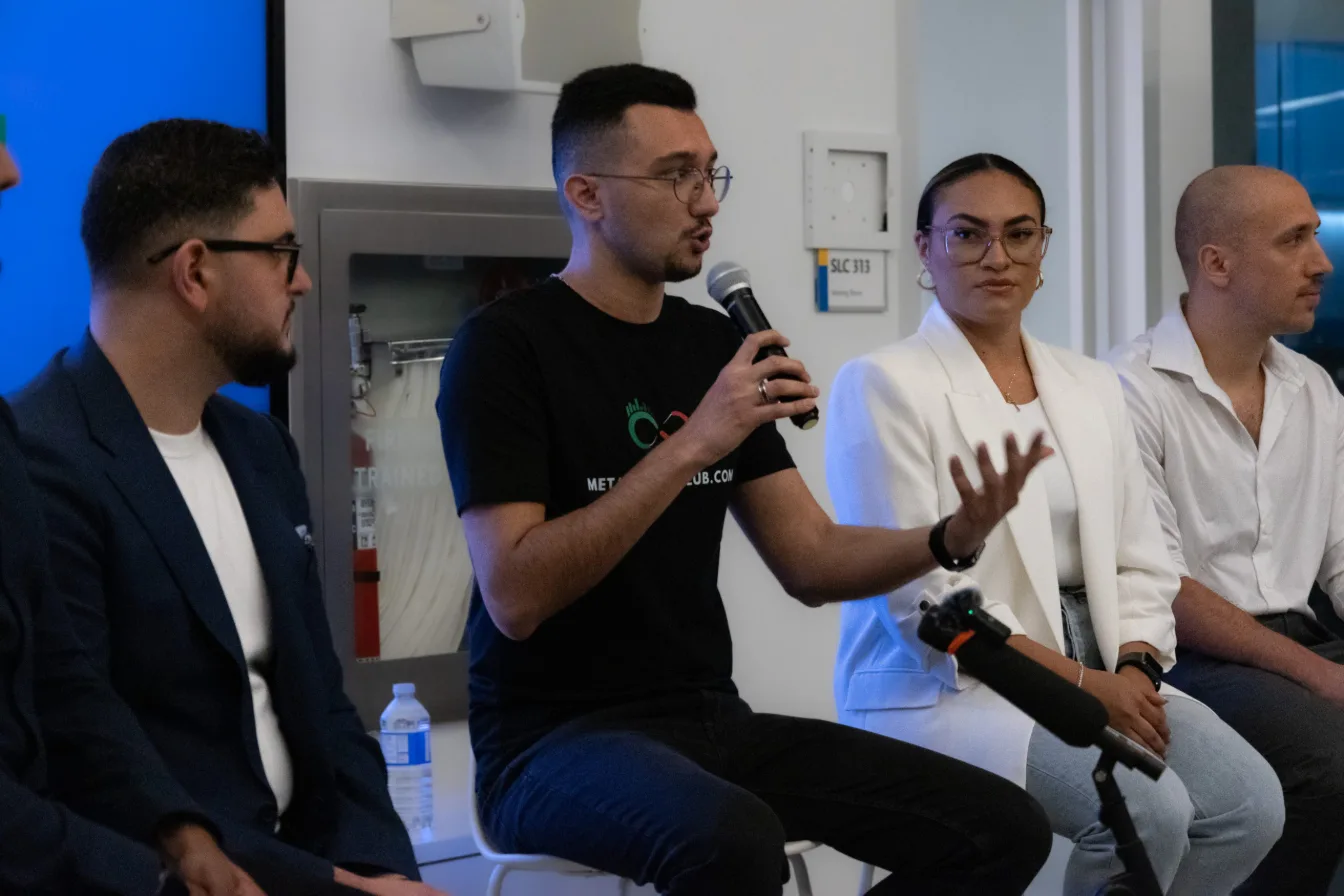 Shahryar Rahmani speaking on a panel at a Meta Trading Club event