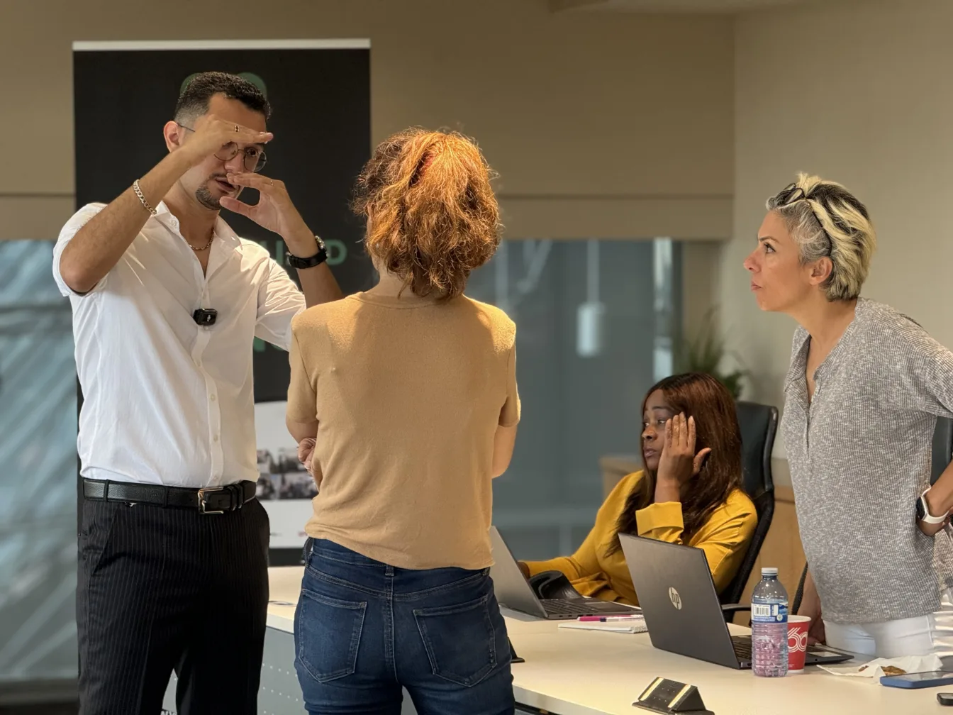 Attendees in discussion during a break at a Meta Trading Club workshop